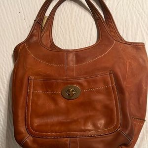 Older Coach leather bag. Good condition. No damage or scratches.